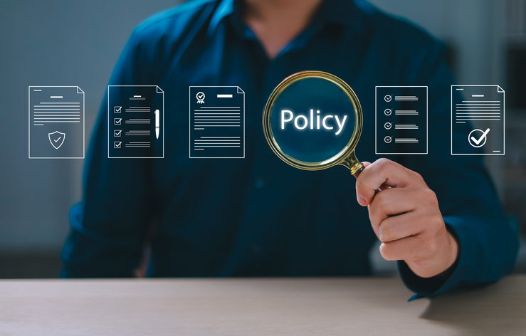 magnifying glass with policy written inside