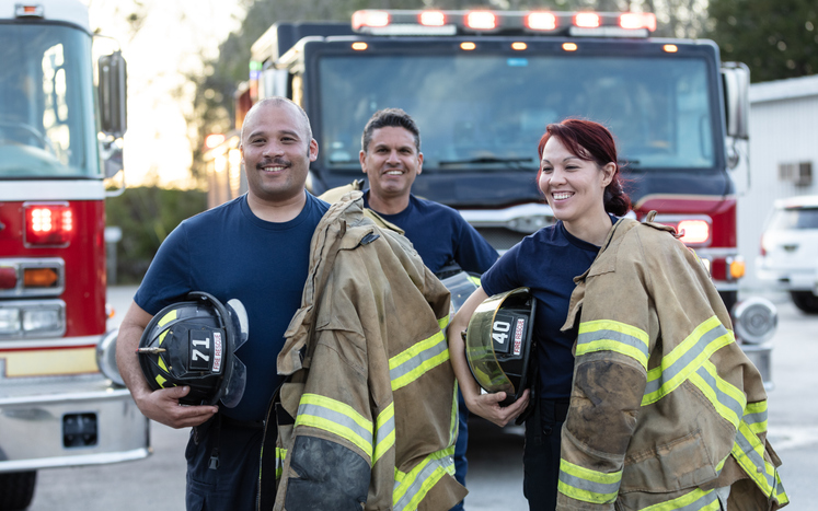 three multiracial firefighters